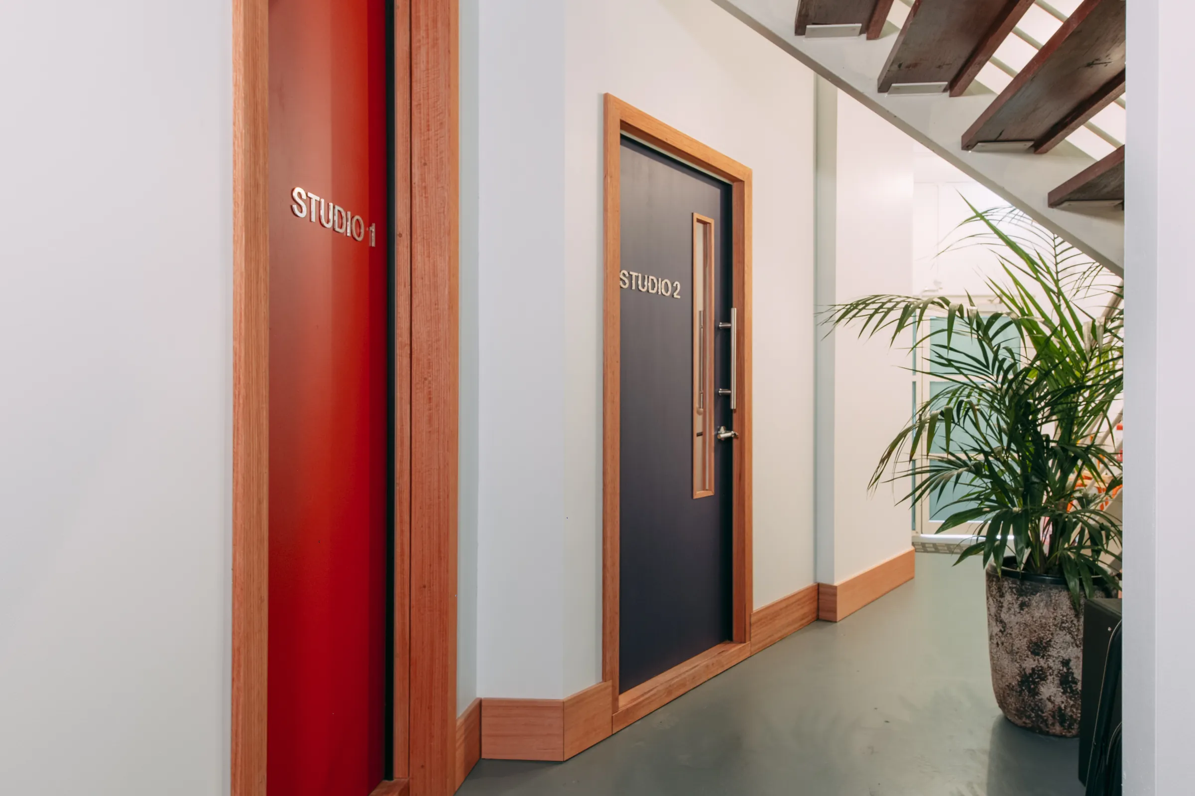 The Kiln Studios corridor - the red Studio 1 door and Studio 2 beyond